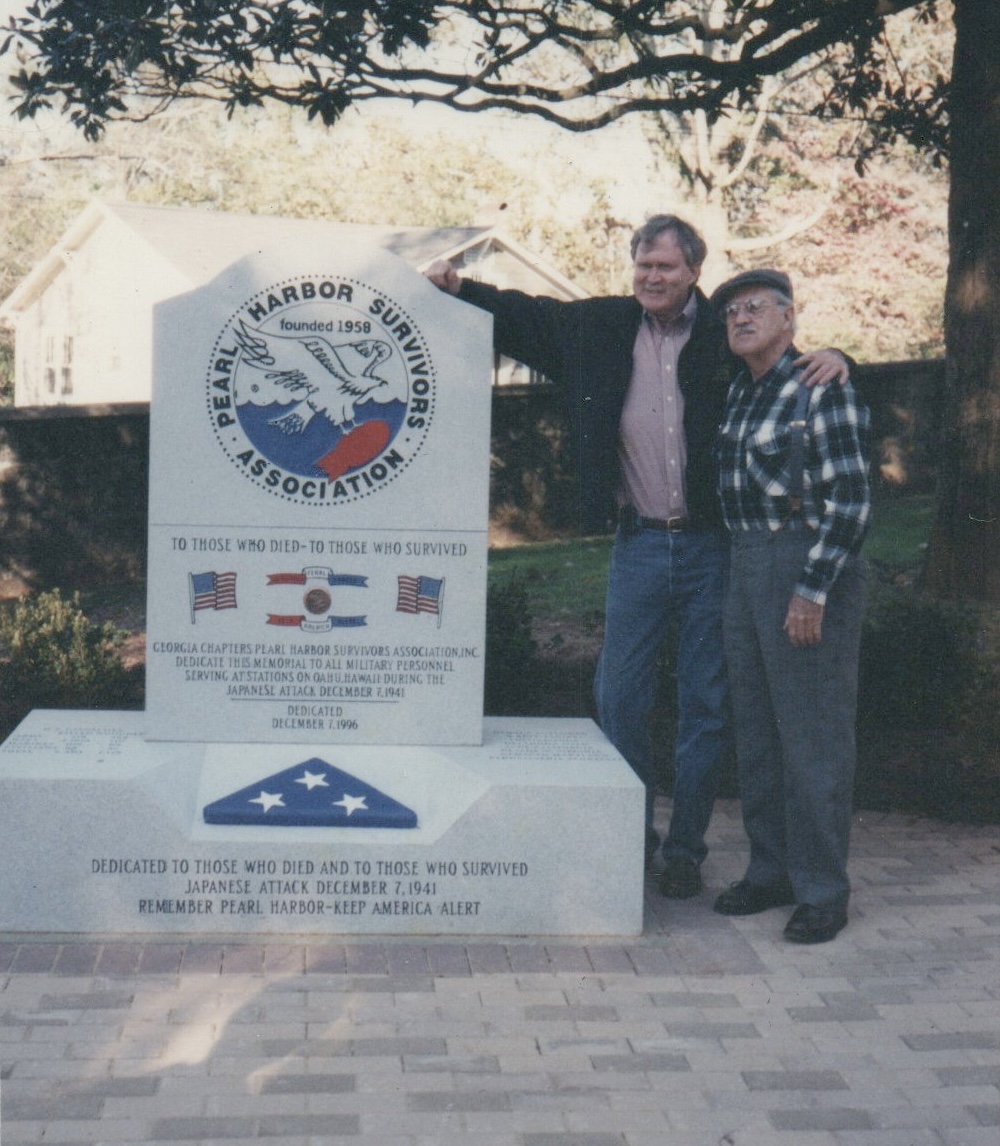 Mack and his youngest son Paul at the monument